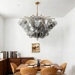 Perrin Smoked Glass Cloud Chandelier | Smoked Glass and Brass | Suspended over a dining table in a minimalist white room | Severn Lighting