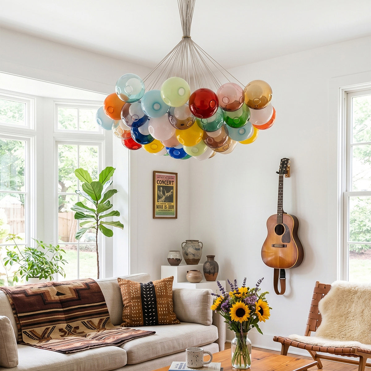 Rainbow Glass Bubble Cluster Chandelier | Multi-colored Blown Glass and Metal Cords | Adding a cheerful touch to a cozy living room with a brown leather couch and an acoustic guitar on the wall | Severn Lighting