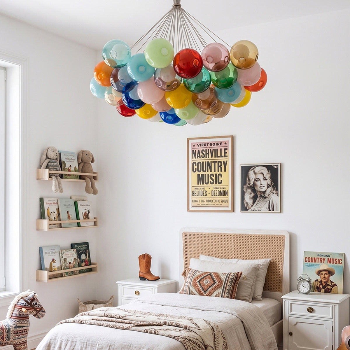 Rainbow Glass Bubble Cluster Chandelier | Multi-colored Blown Glass and Metal Cords | Casting a warm glow in a cozy bohemian style bedroom with a wooden bed and patterned bedding | Severn Lighting