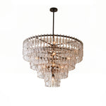 Rainer Cascading Glass Rod Chandelier | Clear Glass and Brass | Brass frame option illuminated on a plain white background | Severn Lighting