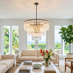Rainer Cascading Glass Rod Chandelier | Clear Glass and Black Metal | Hanging in a bright coastal living room with white sofas | Severn Lighting