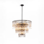 Rainer Cascading Glass Rod Chandelier | Clear Glass and Brass | Brass frame option illuminated on a plain white background | Severn Lighting