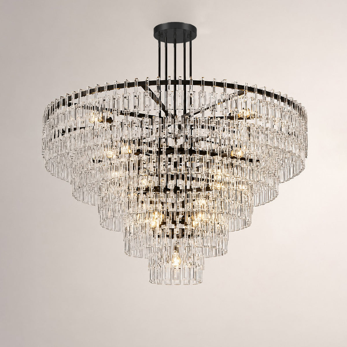 Rainer Cascading Glass Rod Chandelier | Clear Glass and Brass | Brass frame option illuminated on a plain white background | Severn Lighting