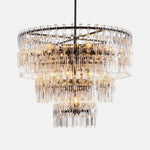 Rainer Cascading Glass Rod Chandelier | Clear Glass and Black Metal | Front full view on a pure white background, illuminated | Severn Lighting