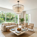 Rainer Cascading Glass Rod Chandelier | Clear Glass and Black Metal | Displayed in a sunlit living space with tropical palm tree views | Severn Lighting