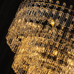 Rainer Cascading Glass Rod Chandelier | Clear Glass and Black Metal | Angle close-up view highlighting the glowing multi-tiered glass rods | Severn Lighting