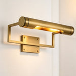Redmond Brass Picture Wall Lamp | Brass and Metal | Side perspective view of the picture light glowing on a plain white wall | Severn Lighting
