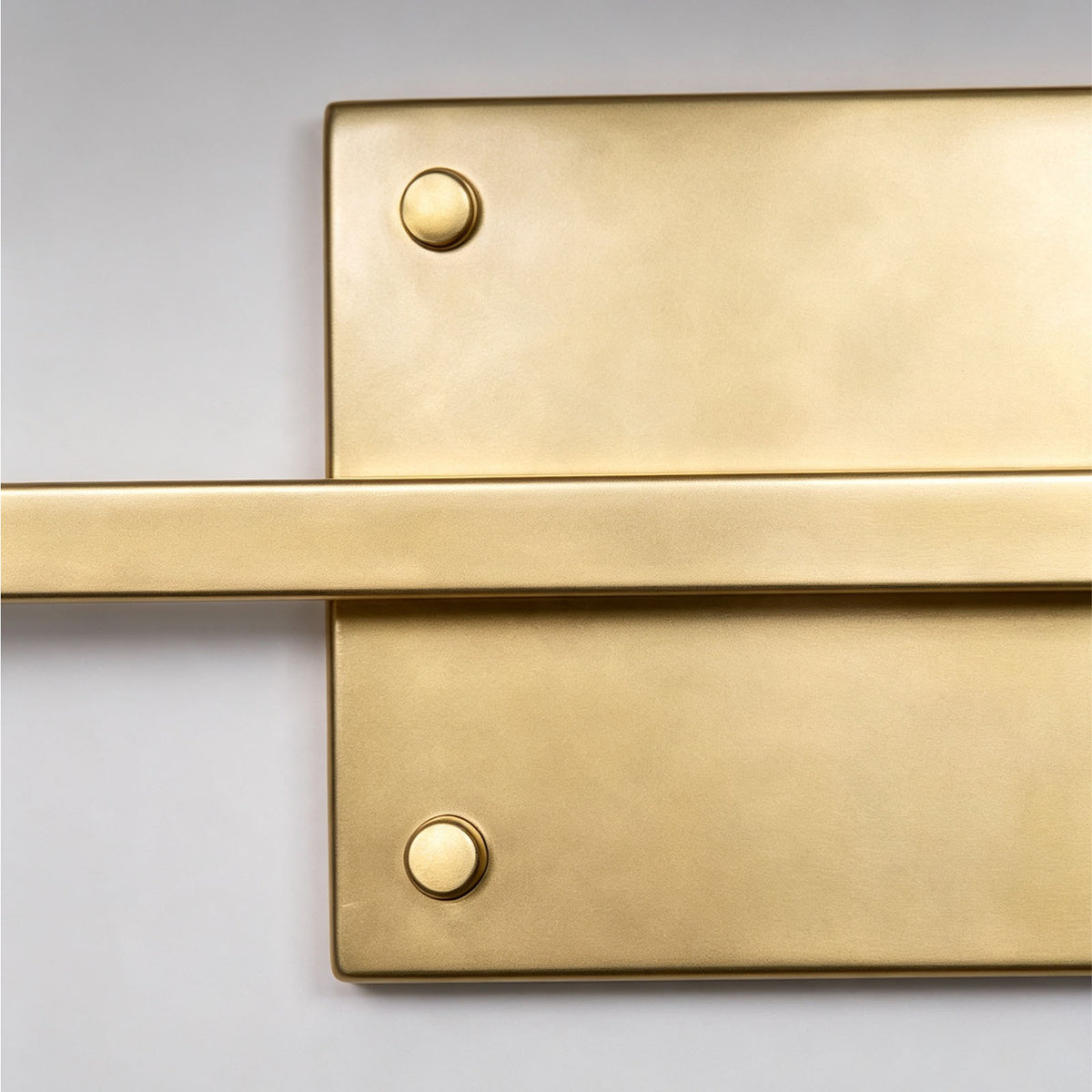 Redmond Brass Picture Wall Lamp | Brass and Metal | Macro shot of the rectangular brass backplate with decorative screws | Severn Lighting