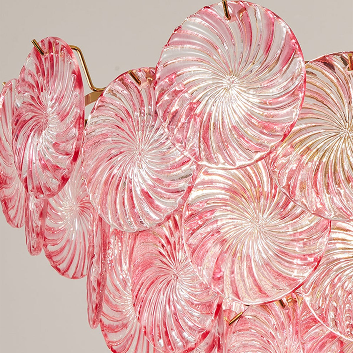 Rosalind Petal Glass Chandelier | Textured Spiral Pink Glass and Gold Metal | Close-up texture shot focusing on the ribbed swirling detail of the pink glass petals | Severn Lighting