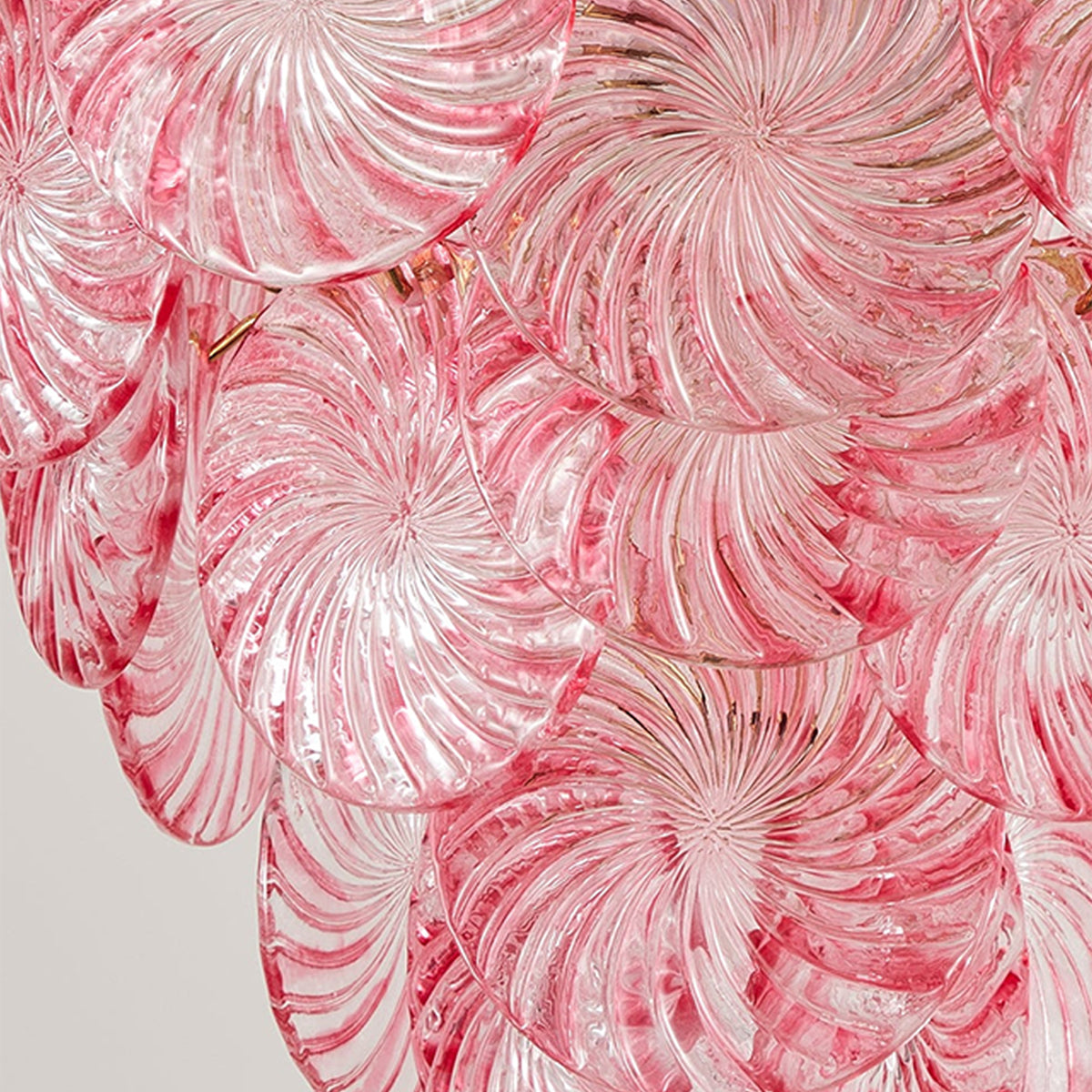 Rosalind Petal Glass Chandelier | Textured Spiral Pink Glass and Gold Metal | Detailed macro preview of the unlit glass leaves showcasing their intricate rippled folds | Severn Lighting