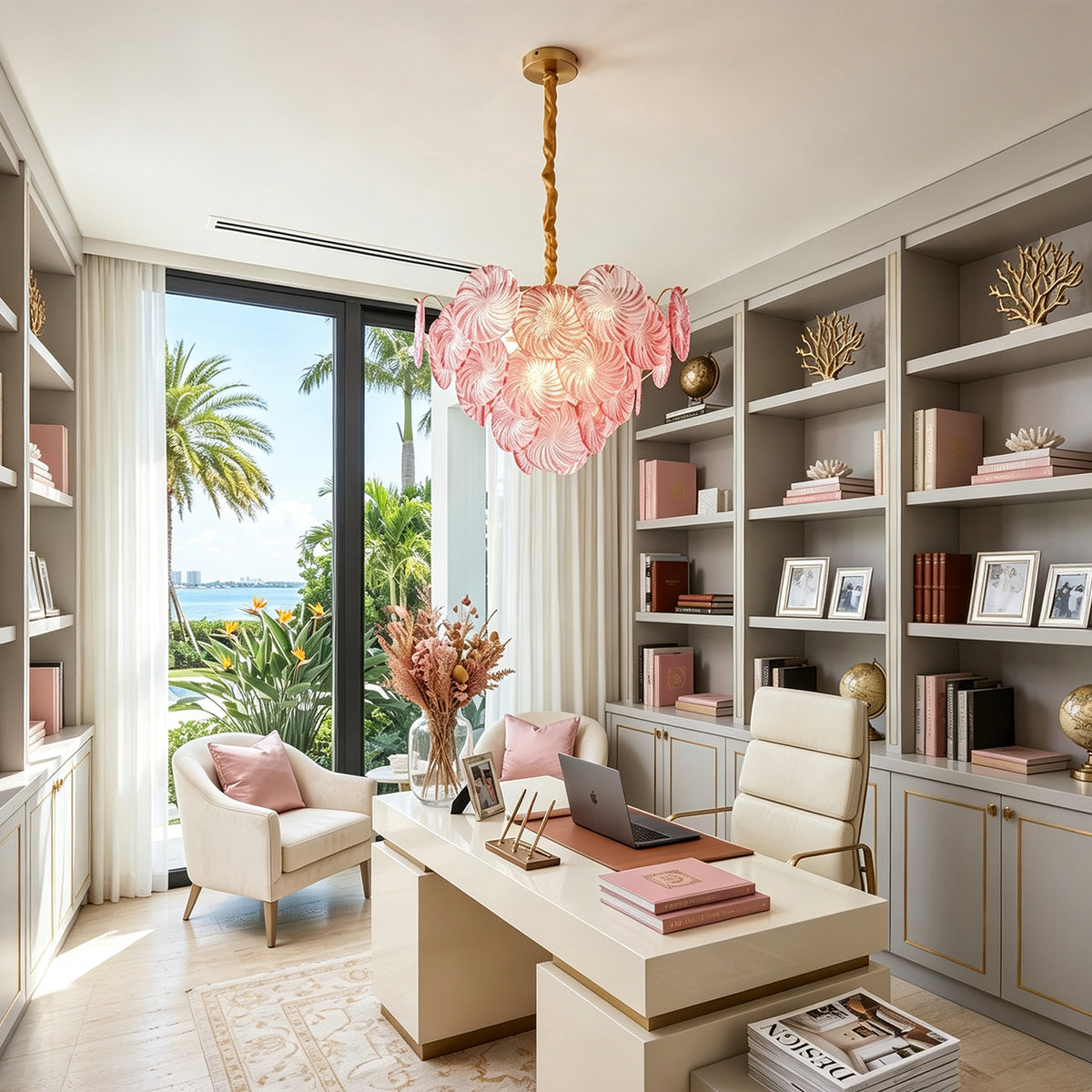Rosalind Petal Glass Chandelier | Textured Spiral Pink Glass and Gold Metal | Illuminating an elegant home office with bookshelves and a desk overlooking tropical trees | Severn Lighting