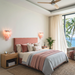 Rosalind Rose Glass Wall Sconce | Glass, Metal | Flanking a bed with a dusty pink headboard in a contemporary coastal bedroom, radiating a cozy pink glow | Severn Lighting
