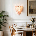 Rosalind Rose Glass Wall Sconce | Glass, Metal | Mounted gracefully on a white classic paneled wall in a refined dining room next to a round marble table | Severn Lighting