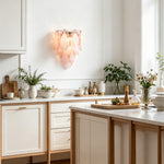 Rosalind Rose Glass Wall Sconce | Glass, Metal | Installed as a charming decorative wall light casting a soft rosy glow in a bright modern kitchen space with indoor plants | Severn Lighting