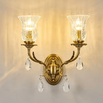 Rosamund Fluted Glass Crystal Brass Wall Lamp | Glass, Crystal and Brass | Double sconce variant illuminated warmly against a plain wall | Severn Lighting