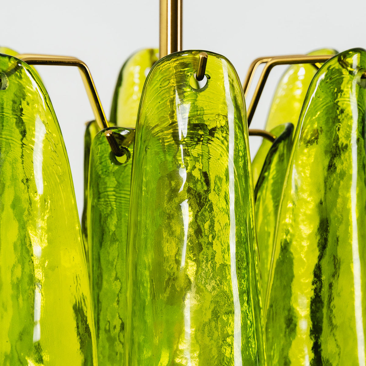 Semoy Curved Glass Petal Pendant Light | Curved Glass and Brass | Close-up side view highlighting the layered green glass petals and brass frame | Severn Lighting