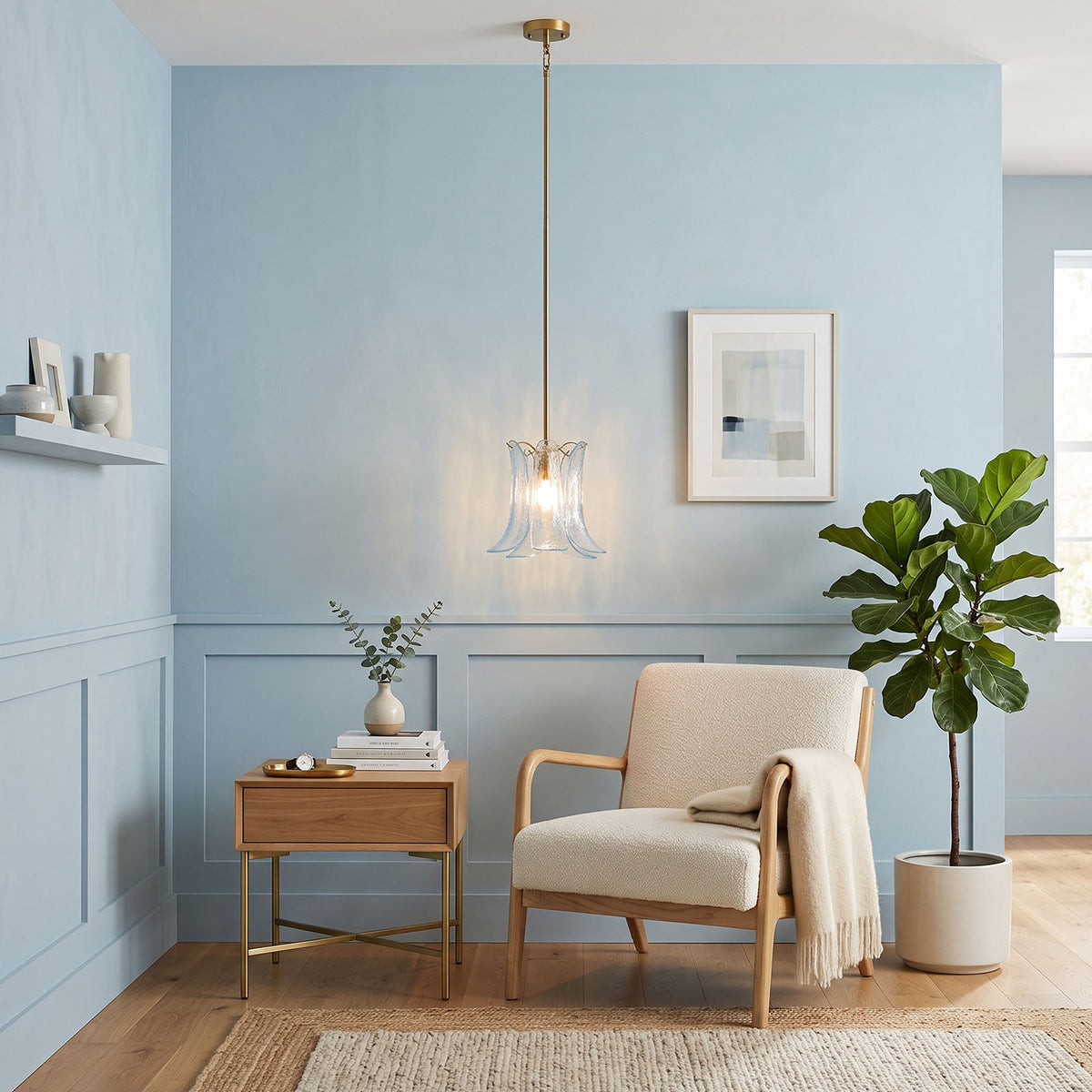 Semoy Curved Glass Petal Pendant Light | Curved Glass and Brass | Suspended in a blue living room near a beige armchair and side table | Severn Lighting