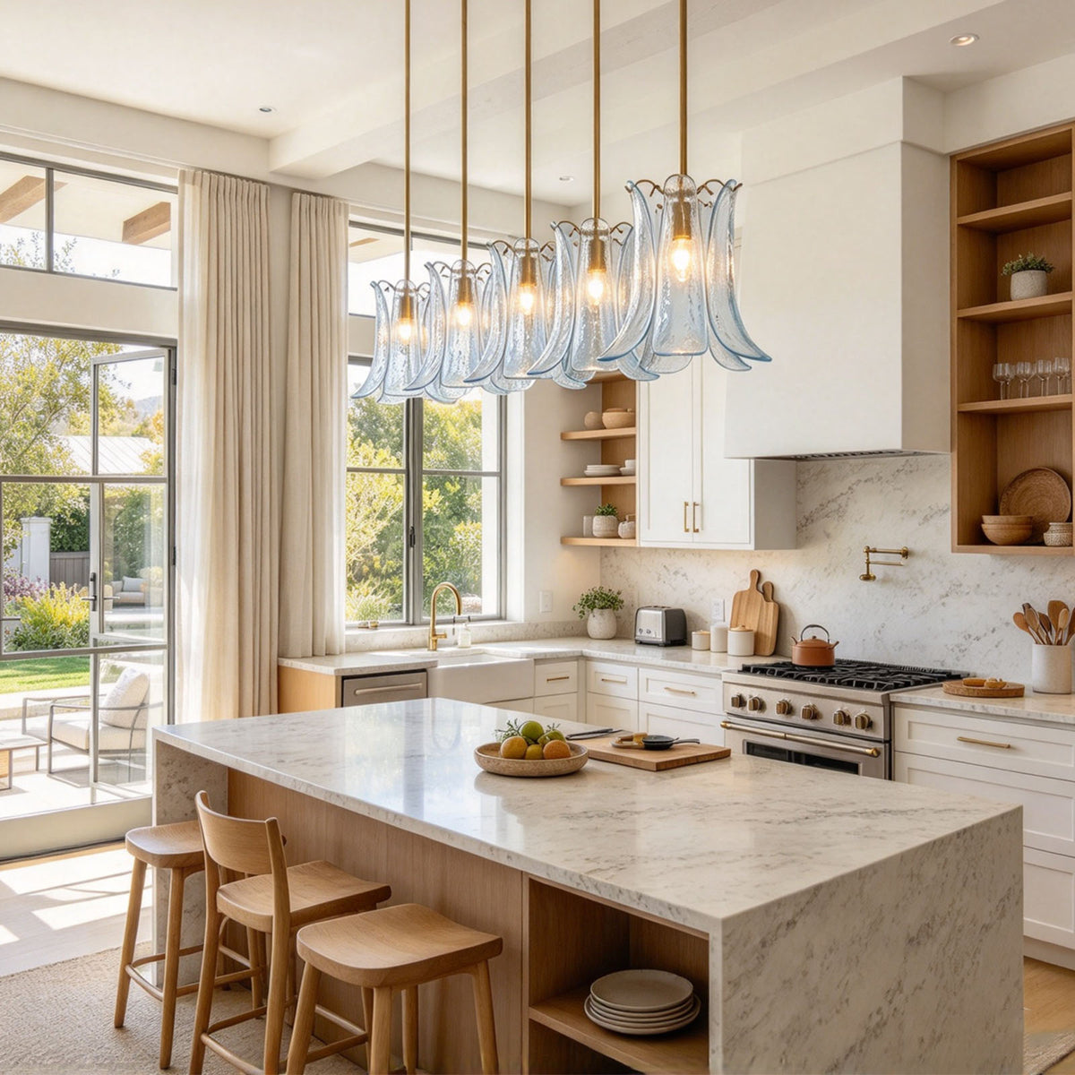 Semoy Curved Glass Petal Pendant Light | Curved Glass and Brass | Row of clear glass pendant lights suspended above a long kitchen counter | Severn Lighting