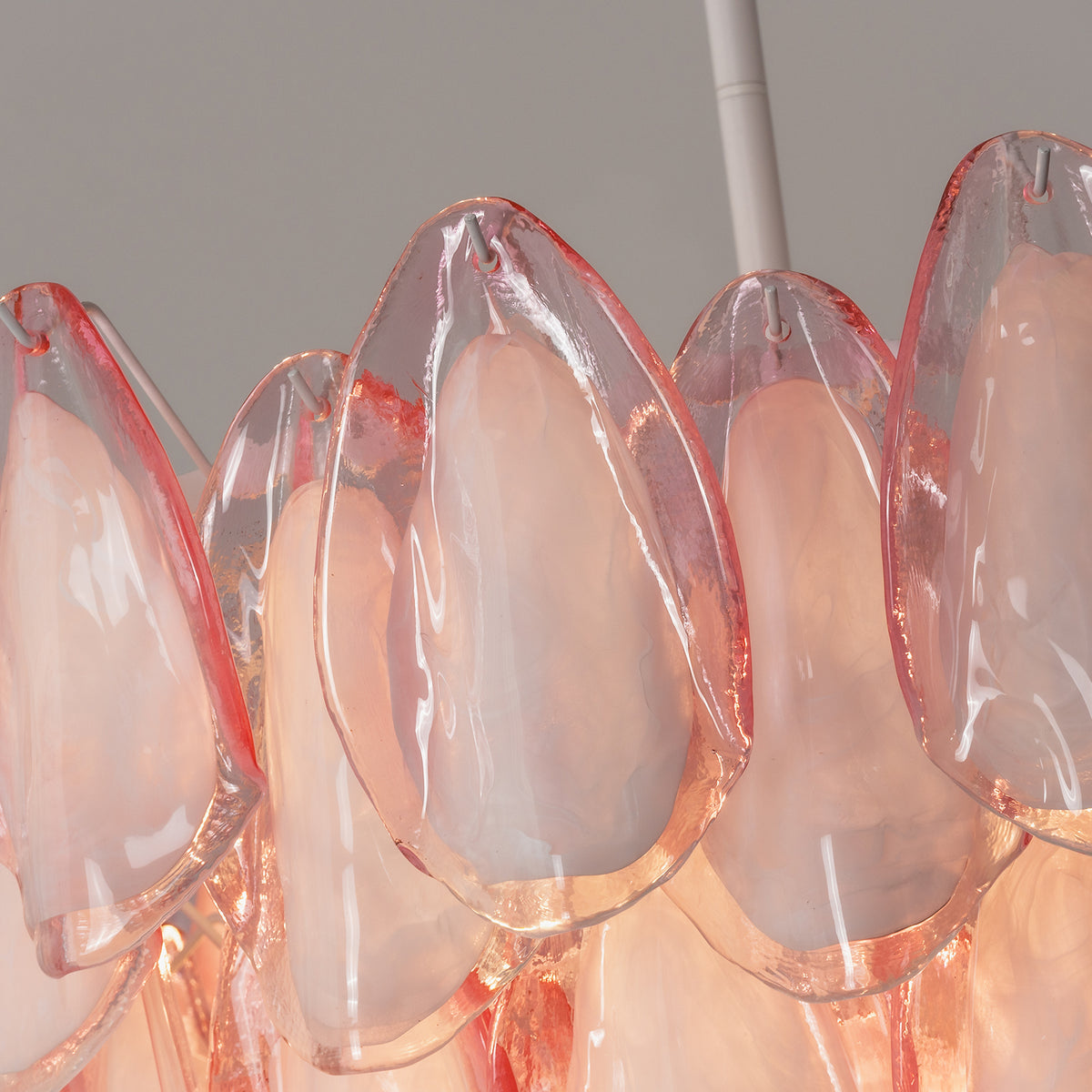 Seraphina Rose Glass Petal Chandelier | Glass, Metal | Detailed close-up focus on the top tier glass panels highlighting the frosted centers and translucent pink curved borders | Detail shot | Severn Lighting