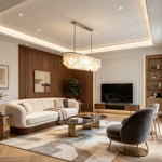 Sirena Capiz Elongated Linear Chandelier | Capiz Shell, Metal | Illumination in a sophisticated open-plan living space featuring cream furniture and wood accents | Samu Lamp Sirena Capiz
