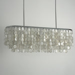 Sirena Capiz Elongated Linear Chandelier | Capiz Shell, Metal | Frontal view of the unlit linear chandelier against a neutral studio grey background, showing its tiered structure | Samu Lamp