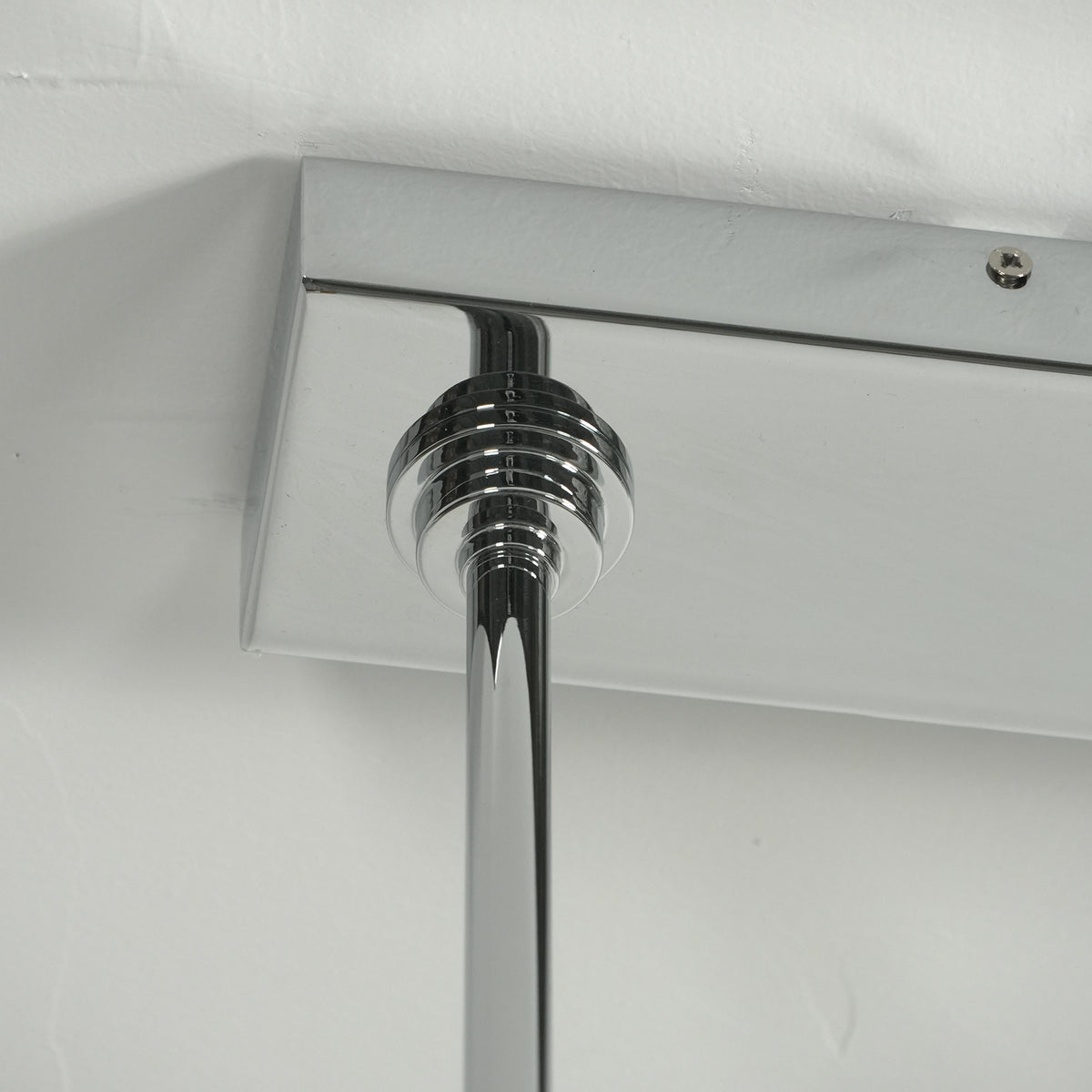 Sirena Capiz Elongated Linear Chandelier | Capiz Shell, Metal | Close-up view of the rectangular chrome polished metal ceiling canopy plate | Detail shot | Samu Lamp Sirena Capiz