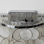 Sirena Capiz Tiered Wall Sconce | Capiz Shell, Metal | Close-up top view showing the polished chrome semi-circular frame and wall mounting bracket | Detail shot | Samu Lamp