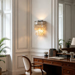 Sirena Capiz Tiered Wall Sconce | Capiz Shell, Metal | Providing a warm ambient glow on a paneled wall in a traditional study room with a dark wood desk | Samu Lamp