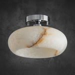 Solaine Alabaster Dome Ceiling Light | Natural Alabaster and Chrome | Chrome finish canopy version illuminated against a dark backdrop | Severn Lighting