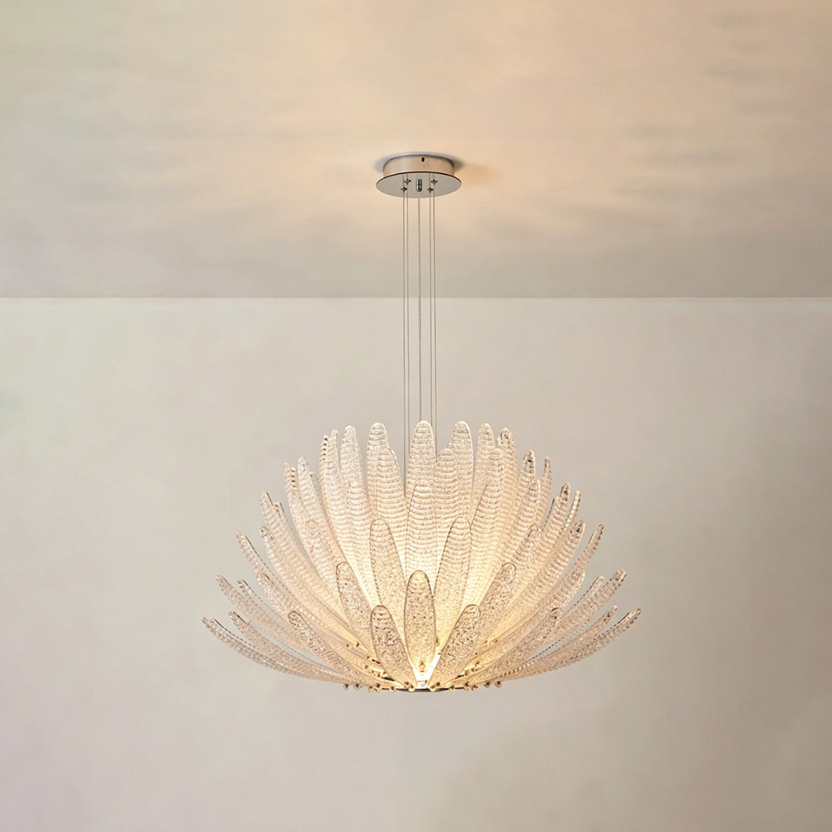 Solaris Agave Glass Starburst Chandelier | White Textured Glass | Full product display of the illuminated white glass version against a light neutral backdrop | Severn Lighting