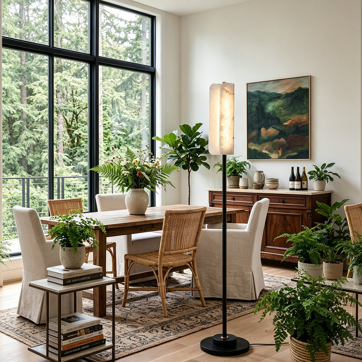 Stellan Alabaster Column Floor Lamp | Natural Alabaster, Brass and Black Metal | Displayed in a sunlit dining room near a wooden dining set | Severn Lighting