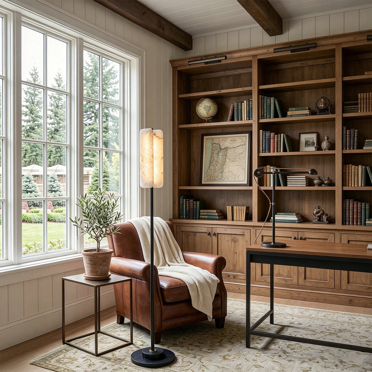 Stellan Alabaster Column Floor Lamp | Natural Alabaster, Brass and Black Metal | Positioned in a warm study room beside a leather armchair | Severn Lighting