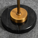 Stellan Alabaster Column Floor Lamp | Natural Alabaster, Brass and Black Metal | Close-up of the heavy circular black base and brass collar detail | Severn Lighting