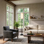 Stellan Alabaster Column Floor Lamp | Natural Alabaster, Brass and Black Metal | Enhancing a bright sitting area with large windows | Severn Lighting