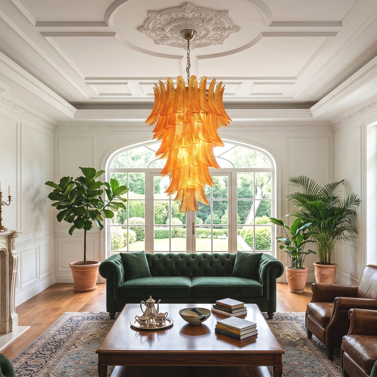 Thessaly Amber Glass Plume Chandelier | Amber Glass and Brass | Illuminating a living room with a green velvet sofa | Severn Lighting