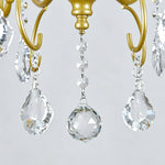Torvald Scrolled Crystal Brass Chandelier | Cut Crystal and Brass | Macro close-up of sparkling hanging crystal droplets and faceted sphere | Severn Lighting