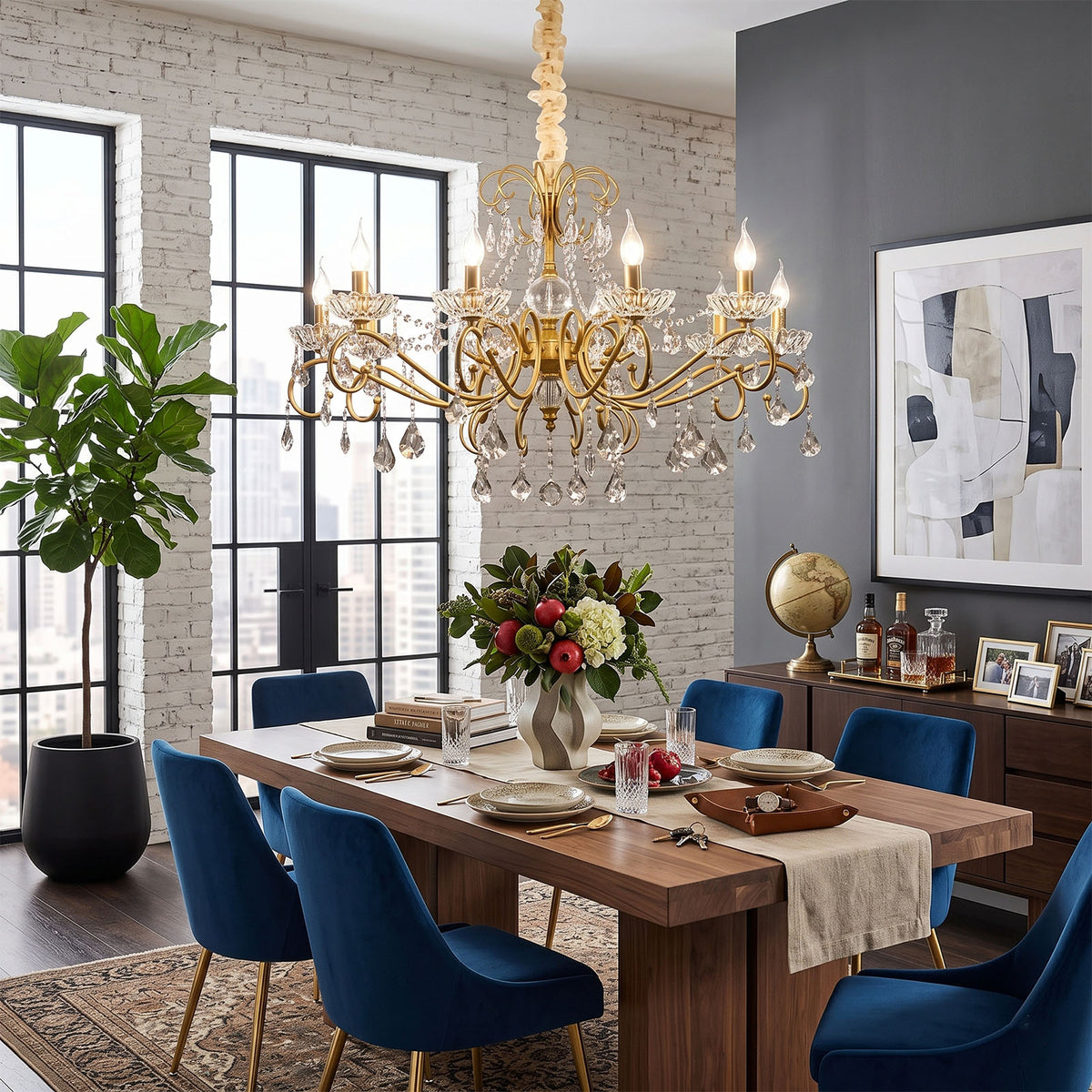 Torvald Scrolled Crystal Brass Chandelier | Cut Crystal and Brass | Displayed above a dining table set with blue velvet armchairs | Severn Lighting