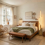 Trelune Column Floor Lamp | Alabaster and Brass | Placed in a sunny living room corner beside green sofa | Severn Lighting