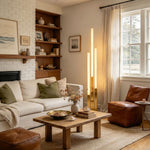 Trelune Column Floor Lamp | Alabaster and Brass | Bedside accent lighting in a rustic wooden bedroom | Severn Lighting