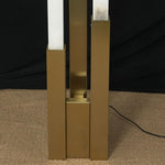 Trelune Column Floor Lamp | Solid Brushed Brass | Close-up of tiered brass base sleeves and power cord | Severn Lighting