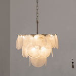 Vaucelle Swirled Glass Disc Tiered Chandelier | Swirled Glass and Brass | Studio product view of white glass disc variant hanging illuminated | Severn Lighting