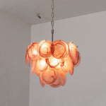 Vaucelle Swirled Glass Disc Tiered Chandelier | Swirled Glass and Brass | Full product shot of pink swirled glass disc variant illuminated | Severn Lighting