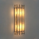 Veraune Bar Wall Sconce | Alabaster and Brass | Front illuminated view on dark wall with warm backlight | Severn Lighting