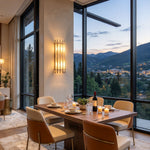 Veraune Bar Wall Sconce | Alabaster and Brass | Lit in an evening dining room with scenic mountain views | Severn Lighting