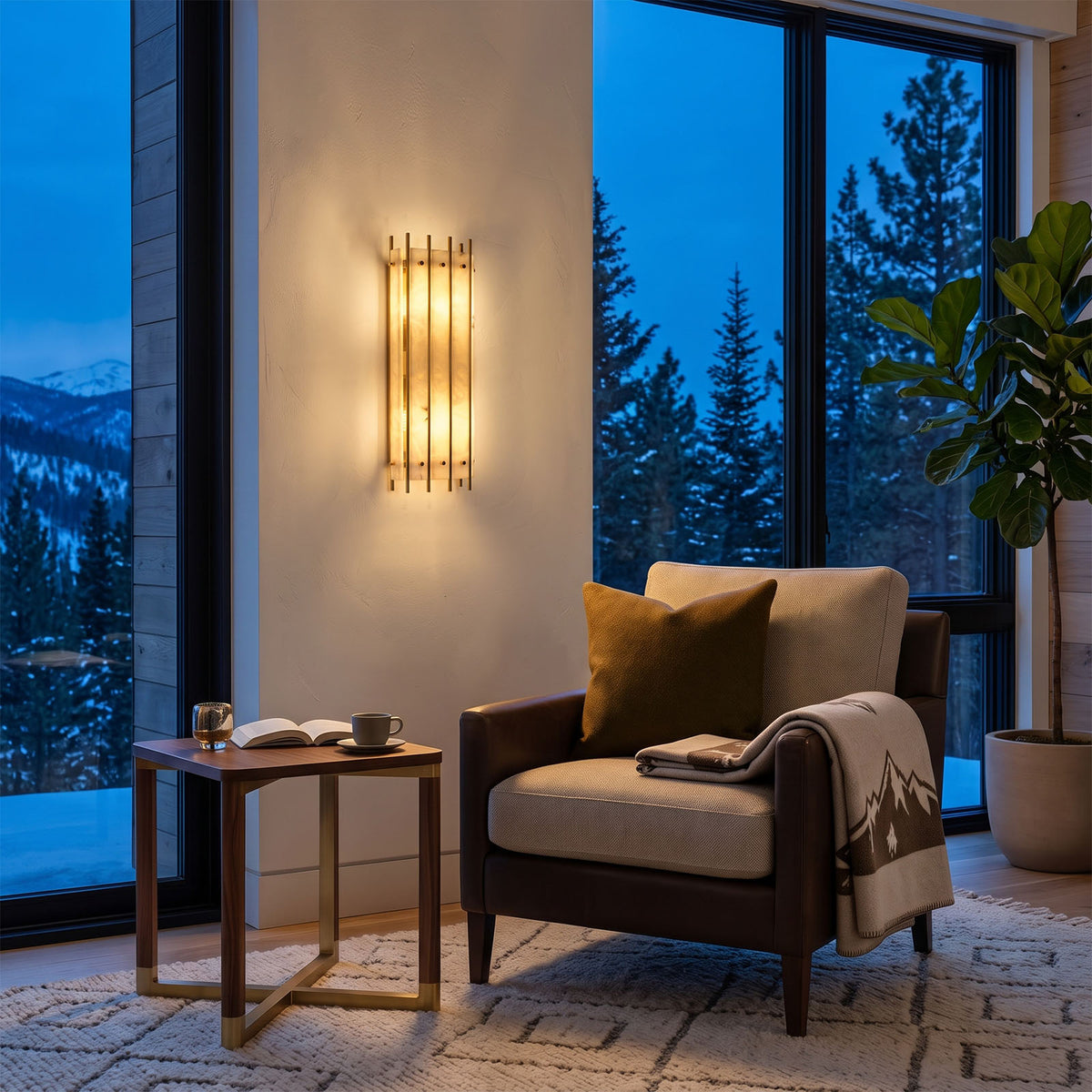 Veraune Bar Wall Sconce | Alabaster and Brass | Lit beside an armchair and scenic window in a cozy lounge | Severn Lighting