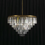 Verity Fringed Glass Tier Chandelier | Fringed Glass and Brass | Full product view unlit displayed against a dark backdrop | Severn Lighting