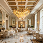 Verity Fringed Glass Tier Chandelier | Fringed Glass and Brass | Hanging in a grand banquet hall above elegant round dining tables | Severn Lighting