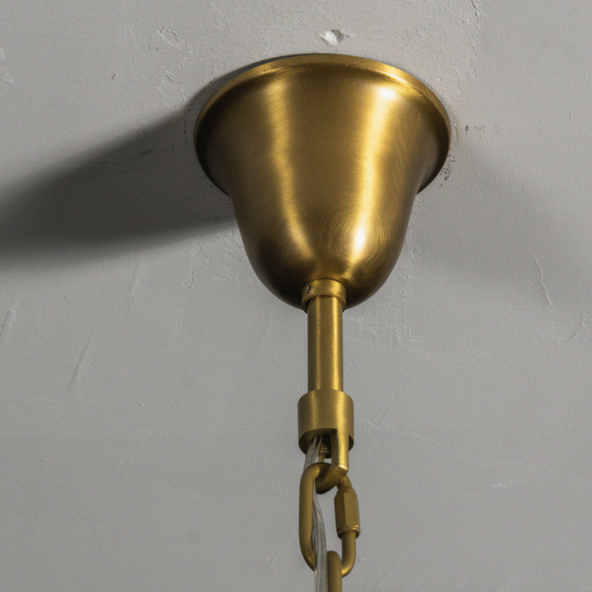 Verity Fringed Glass Tier Chandelier | Fringed Glass and Brass | Close-up view of the brushed brass mounting canopy and ceiling chain | Severn Lighting