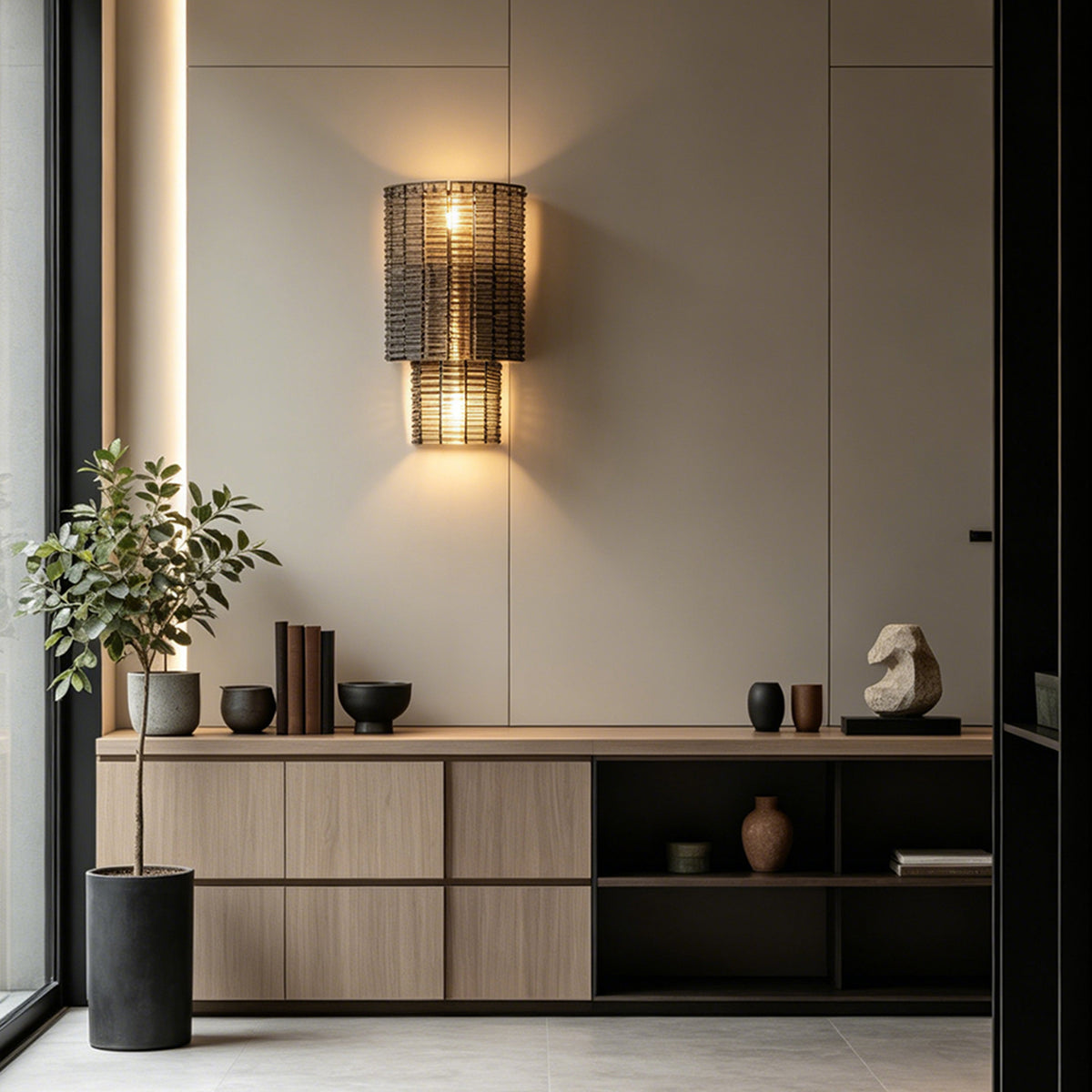 Vespera Tiered Smoky Glass Wall Lamp | Glass, Metal | Wall-mounted above a minimalist light oak slatted credenza cabinet, throwing soft golden light against a smooth beige wall | Severn Lighting