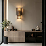 Vespera Tiered Smoky Glass Wall Lamp | Glass, Metal | Wall-mounted above a minimalist light oak slatted credenza cabinet, throwing soft golden light against a smooth beige wall | Severn Lighting